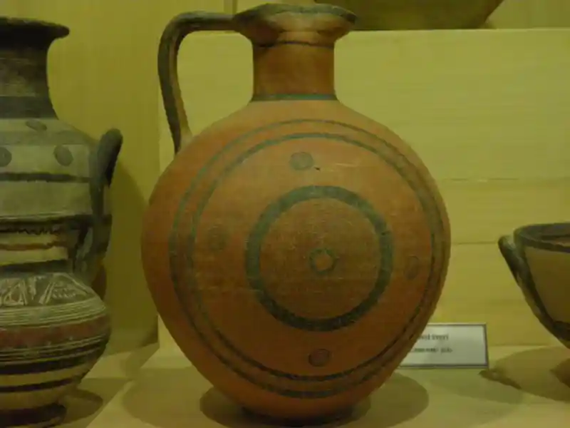 Four-point cross inside a solar disc painted on a clay vase